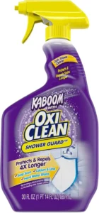 Purple spray bottle of Kaboom with OxiClean Shower Guard daily shower cleaner protecting against soap scum.